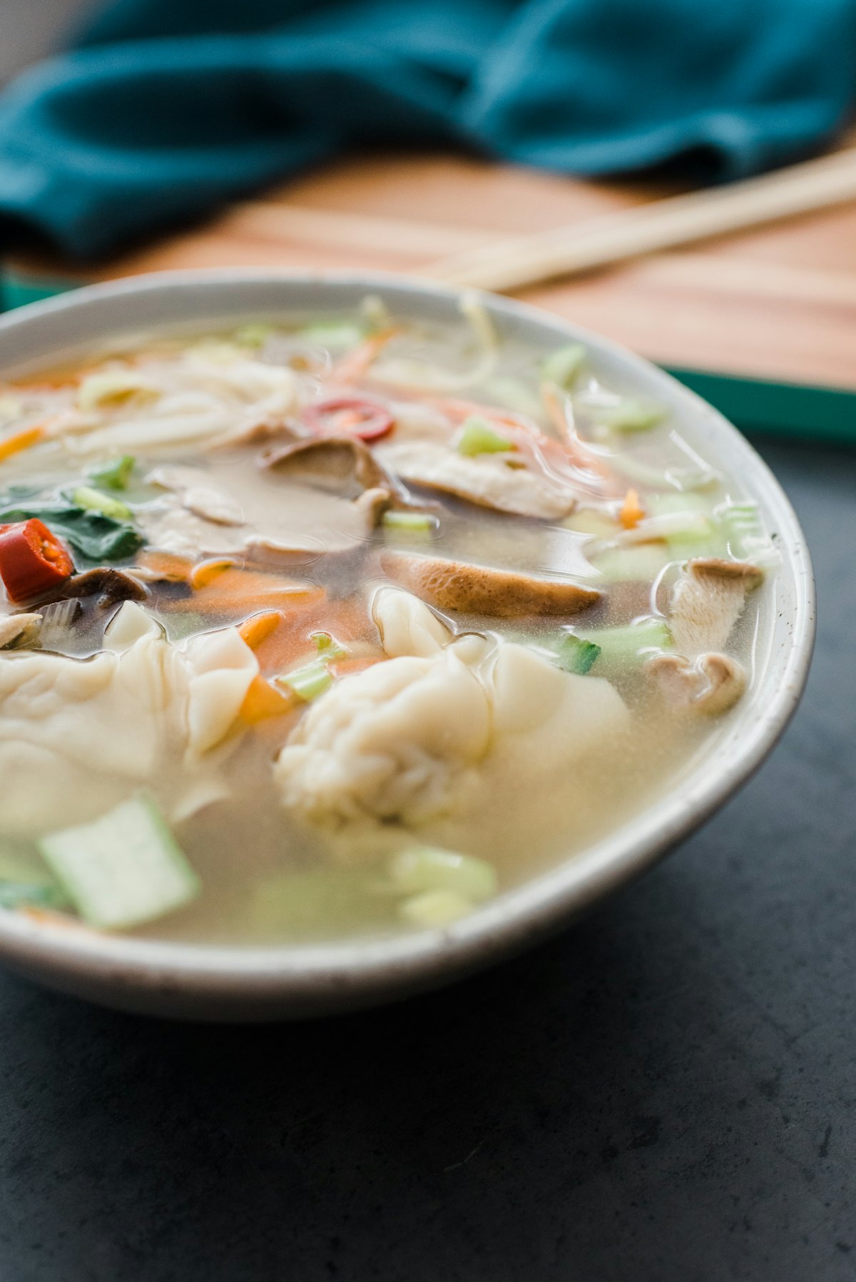 Stock photo of a bowl of wonton soup with vegetables — placeholder, not their kitchen